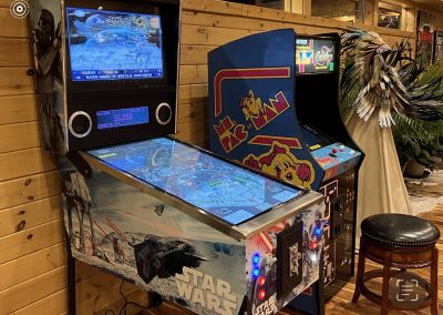 Star Wars virtual pinball machine and Ms. Pac Man arcade machine in a cabin