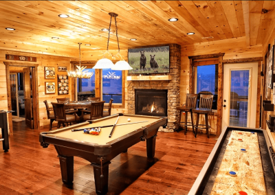 A cabin in the Smoky Mountains with a belmont pool table and shuffleboard