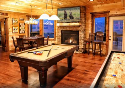 A cabin in the Smoky Mountains with a belmont pool table and shuffleboard